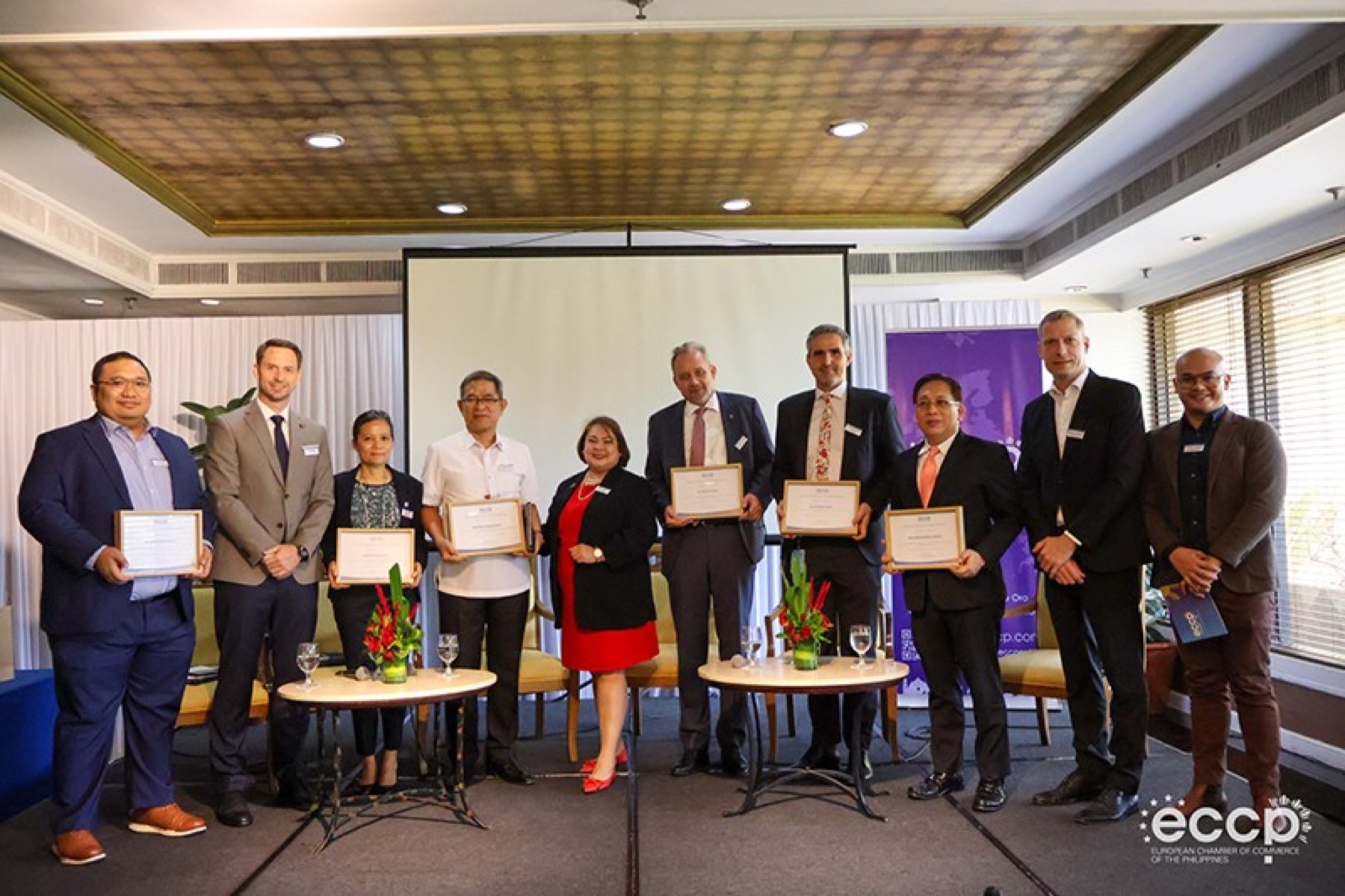 Speakers and members at an ECCP forum